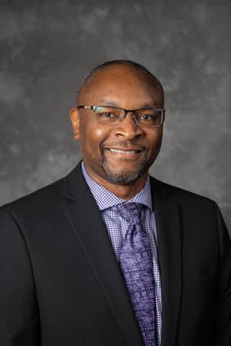 Dr. Aimé